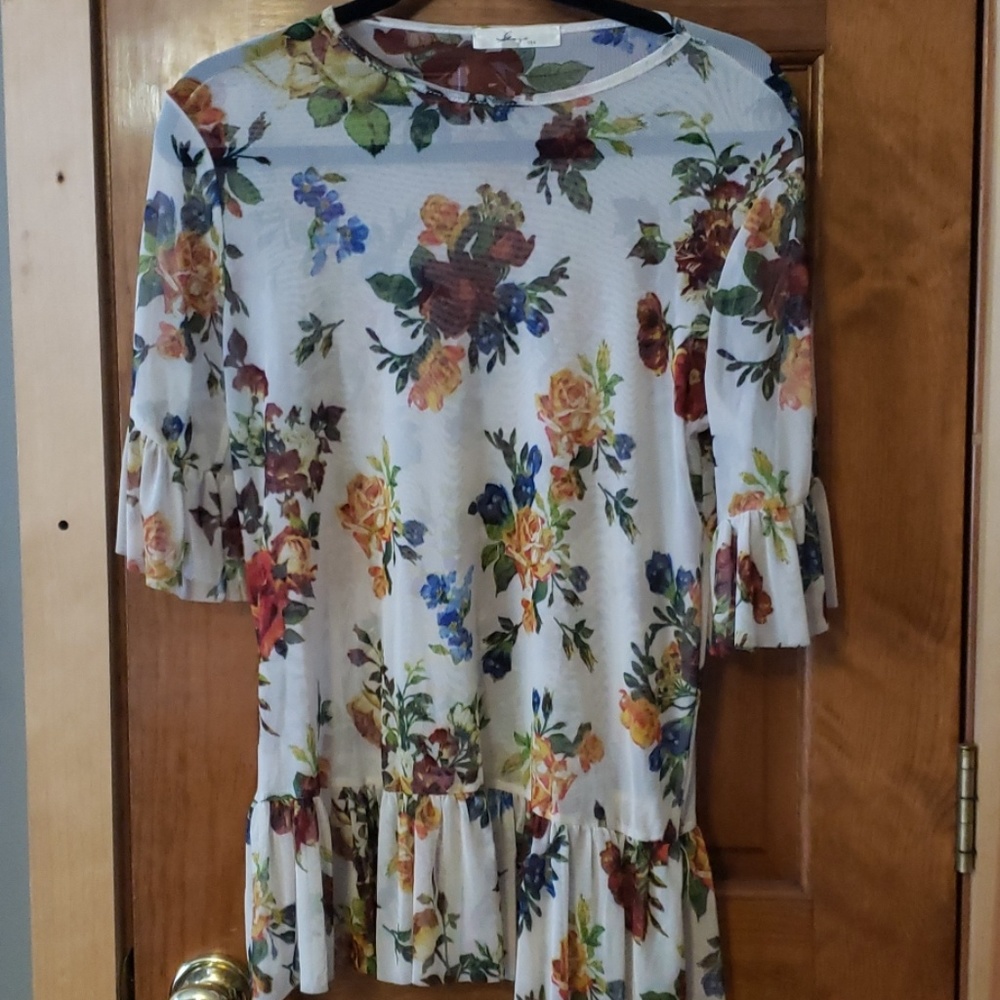 Sheer floral blouse with bell sleeves and ruffles